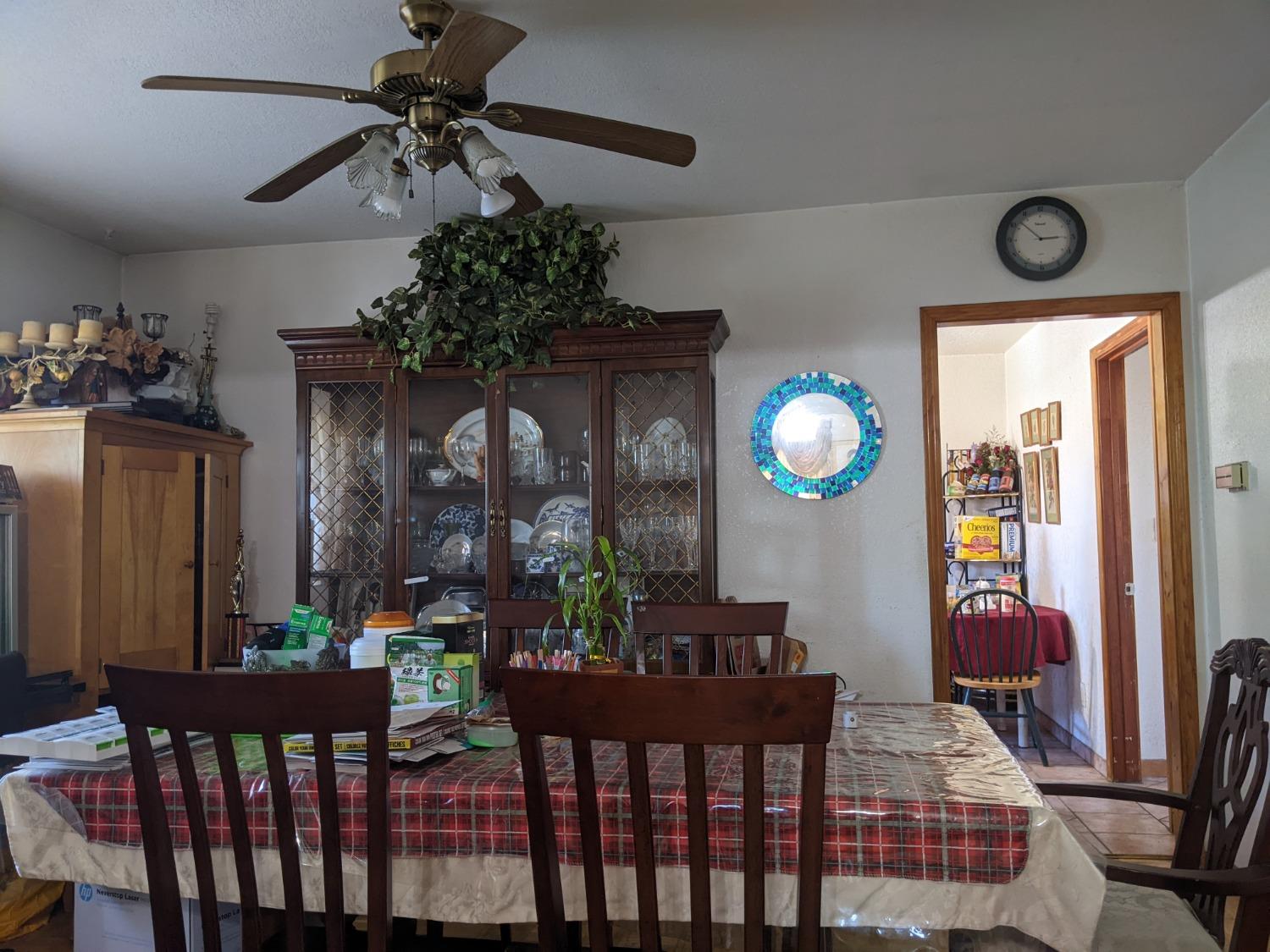 1244 58th Avenue Oakland, CA 94621 - Photo 8 of 9 a view of a dining room with furniture and chandelier