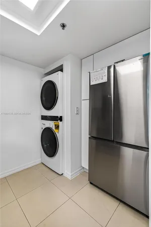 a view of a refrigerator and washer