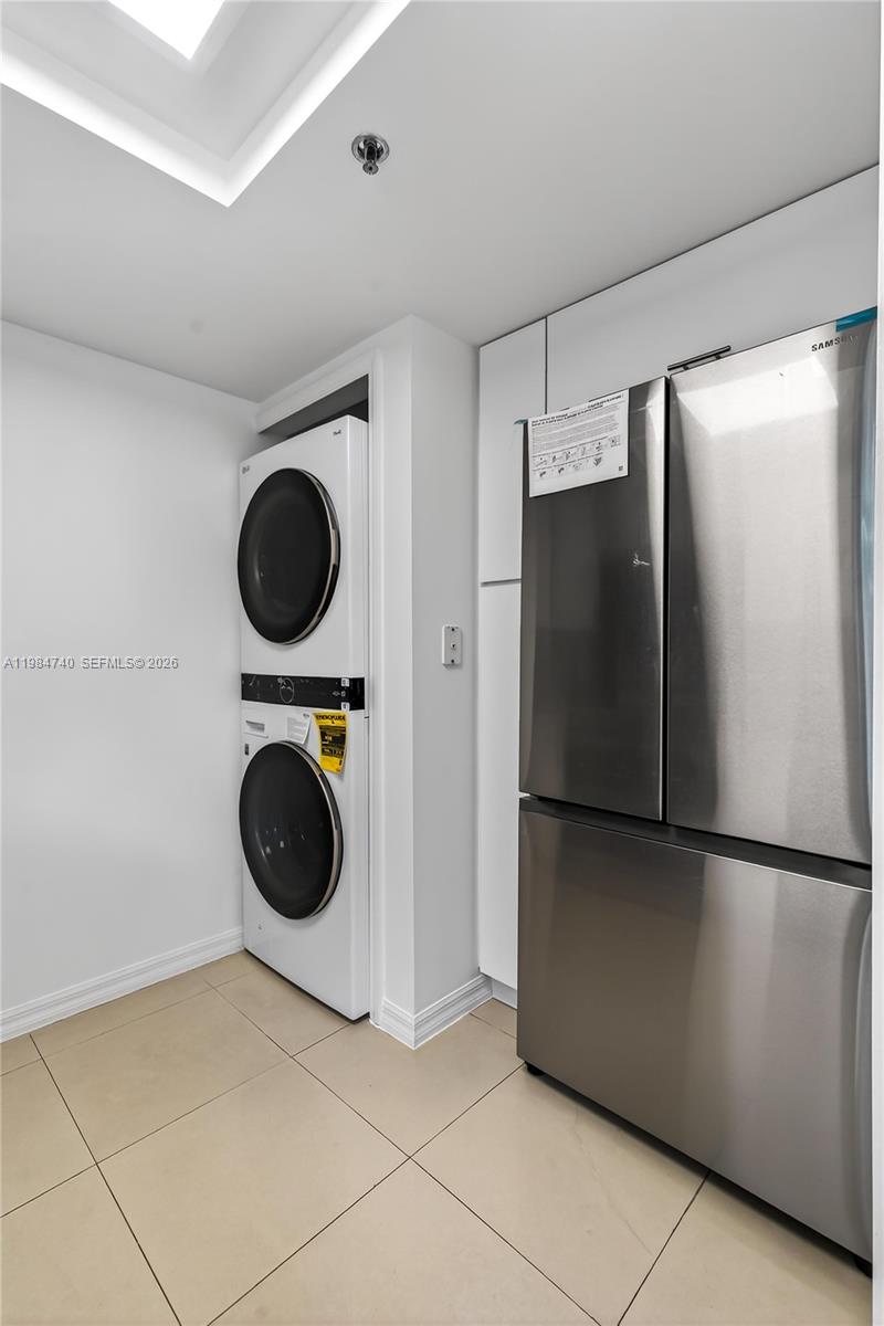 2475 Northwest 16th St Road, Unit 211 Miami, FL 33125 - Photo 13 of 29 a view of a refrigerator and washer