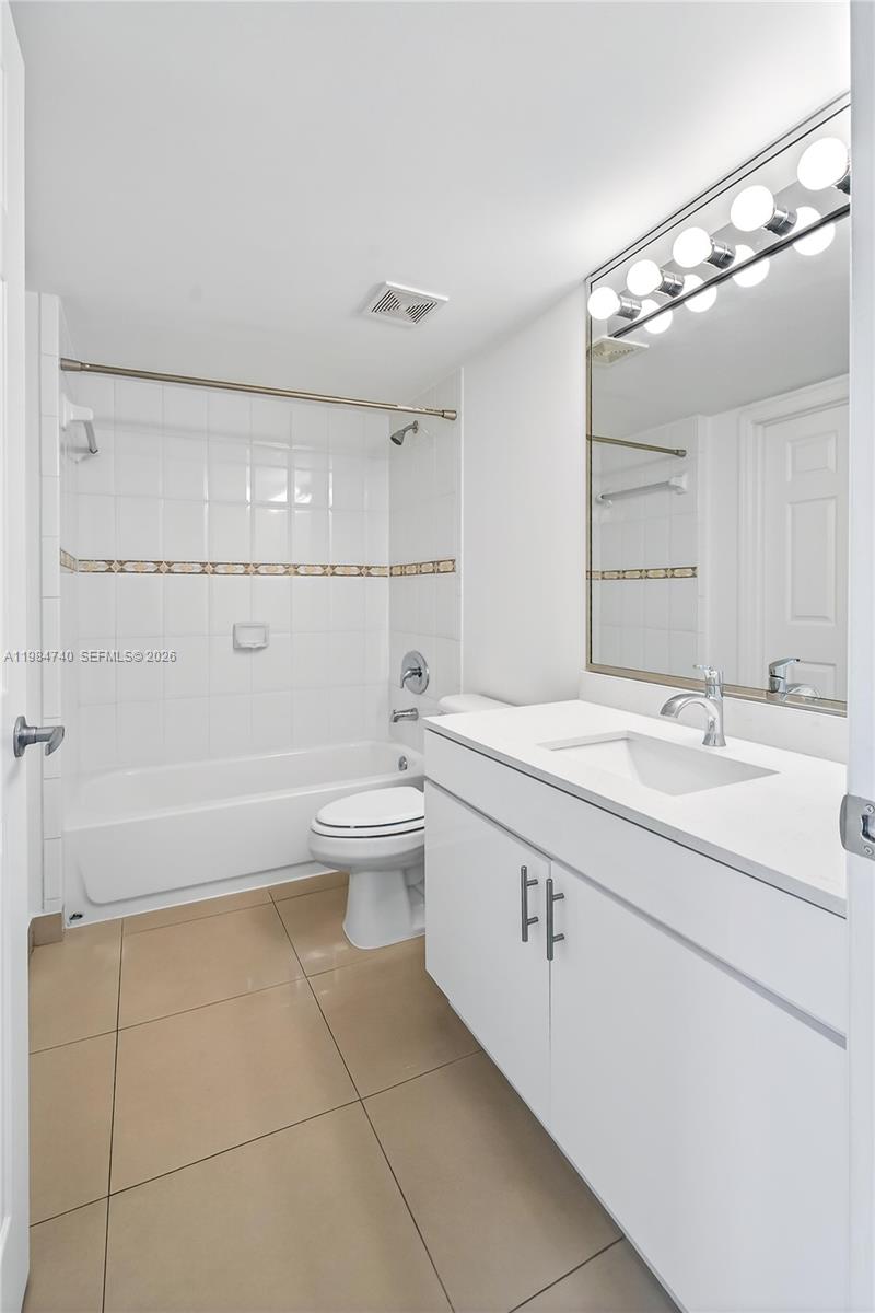 2475 Northwest 16th St Road, Unit 211 Miami, FL 33125 - Photo 23 of 29 a bathroom with a sink a toilet and bathtub