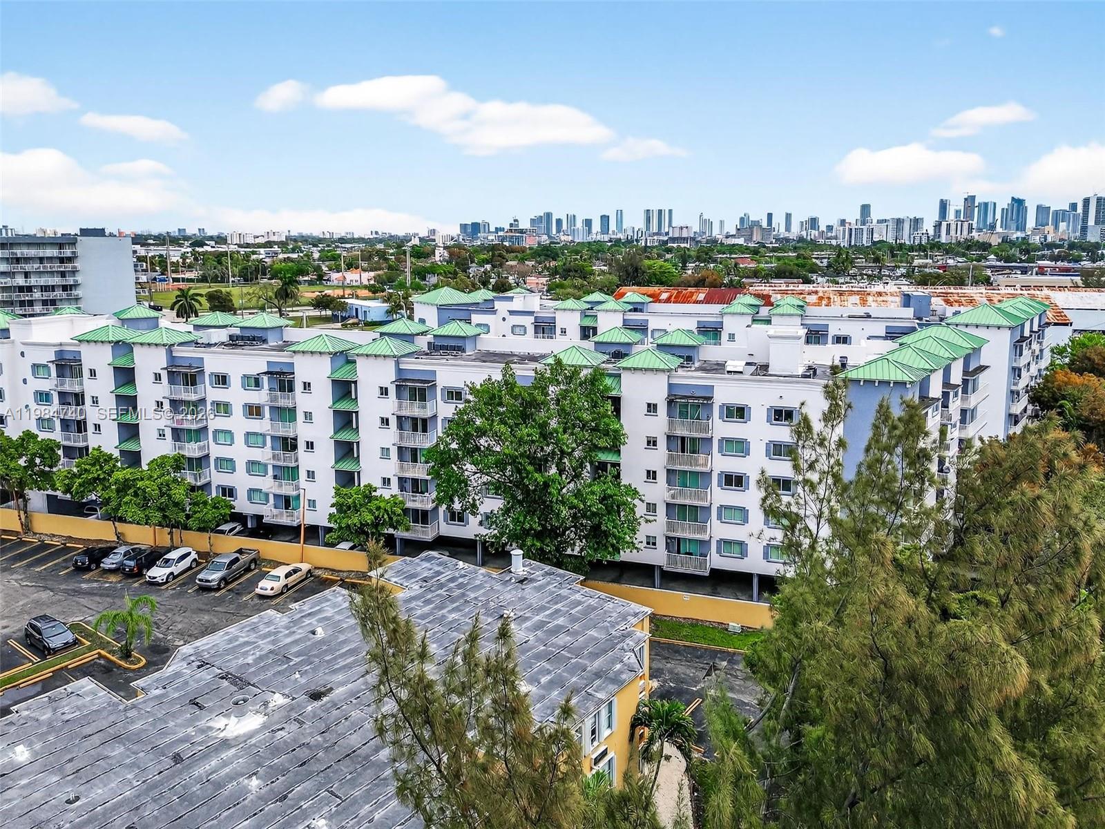 2475 Northwest 16th St Road, Unit 211 Miami, FL 33125 - Photo 26 of 29 a city view with tall buildings