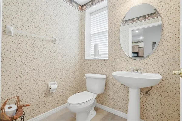 a kitchen with a refrigerator stove top oven and sink