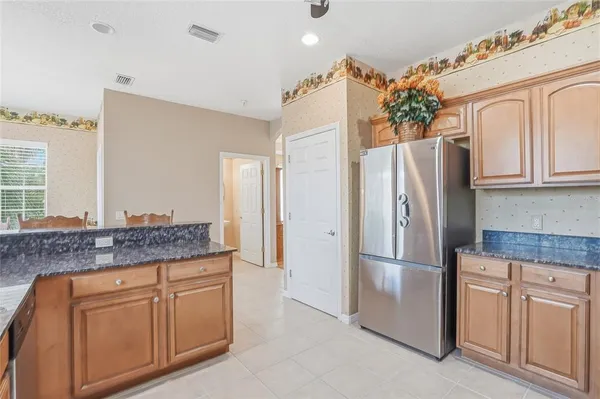 a dining room with furniture a rug and wooden floor