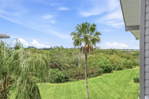 a bathroom with a granite countertop toilet sink and mirror