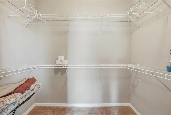 a white bench sitting in front of a house