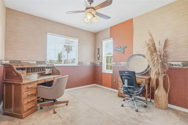 an aerial view of residential houses with outdoor space and parking