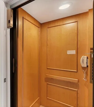 a view of empty room with ceiling fan