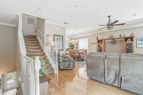 a living room with furniture rug and window