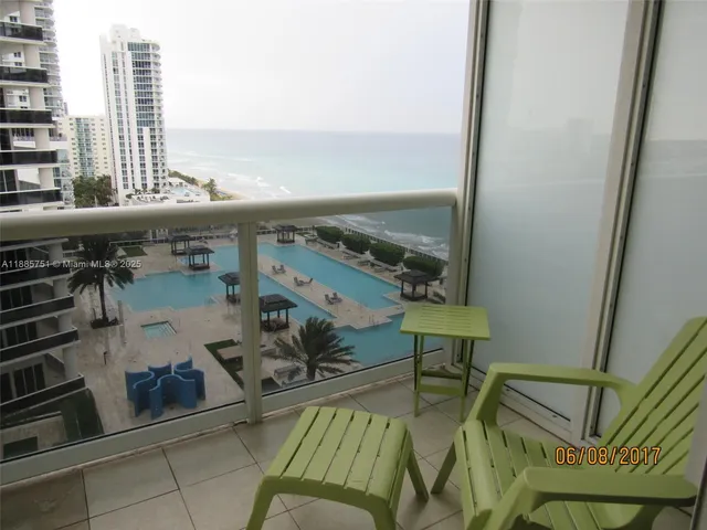 a view of a balcony with chairs