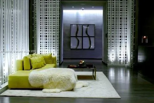 a view of a room with gym equipment and floor to ceiling windows