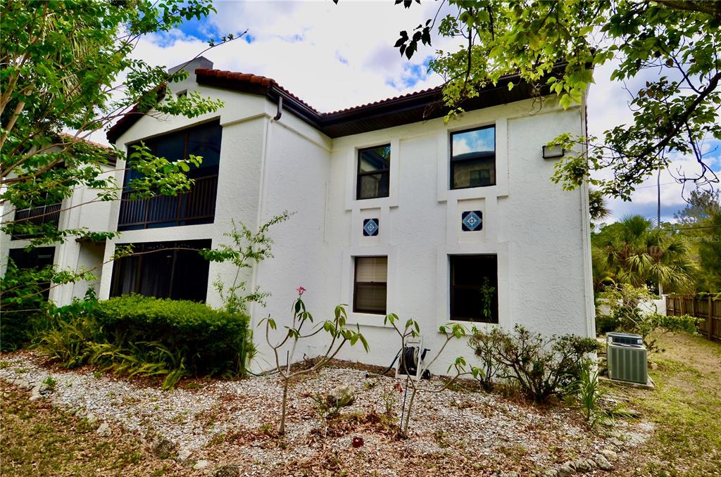 631 North Orange Avenue, Unit 201 Sarasota, FL 34236 - Photo 12 of 14 a front view of a house with garden