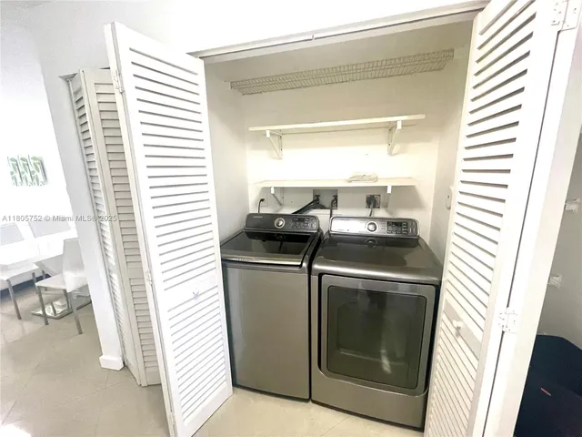 a utility room with washer and dryer