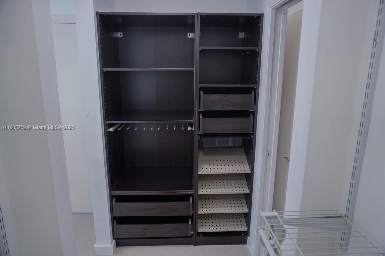 805 Northwest 108th Terrace, Unit 7L5 Pembroke Pines, FL 33026 - Photo 19 of 28 a view of walk in closet