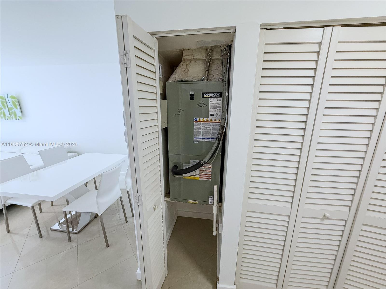 805 Northwest 108th Terrace, Unit 7L5 Pembroke Pines, FL 33026 - Photo 22 of 28 a view of a room that has a bench in it