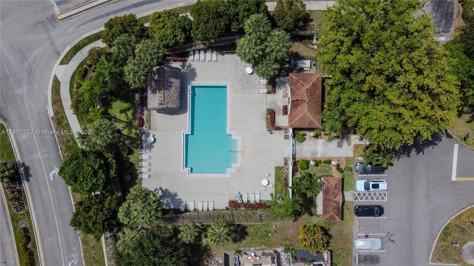 805 Northwest 108th Terrace, Unit 7L5 Pembroke Pines, FL 33026 - Photo 10 of 28 an aerial view of a house with a yard and garden