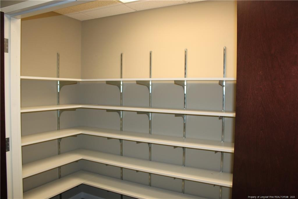 3709 Raeford Road Fayetteville, NC 28304 - Photo 31 of 44 a view of a room with shelves