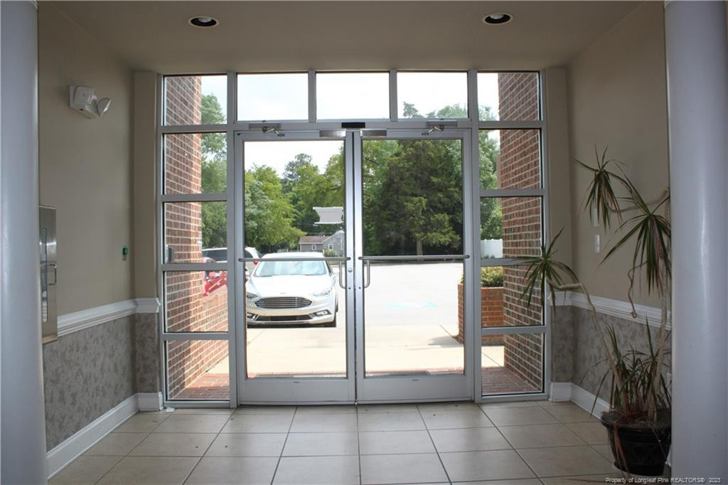 3709 Raeford Road Fayetteville, NC 28304 - Photo 35 of 44 a kitchen with a glass door and a table