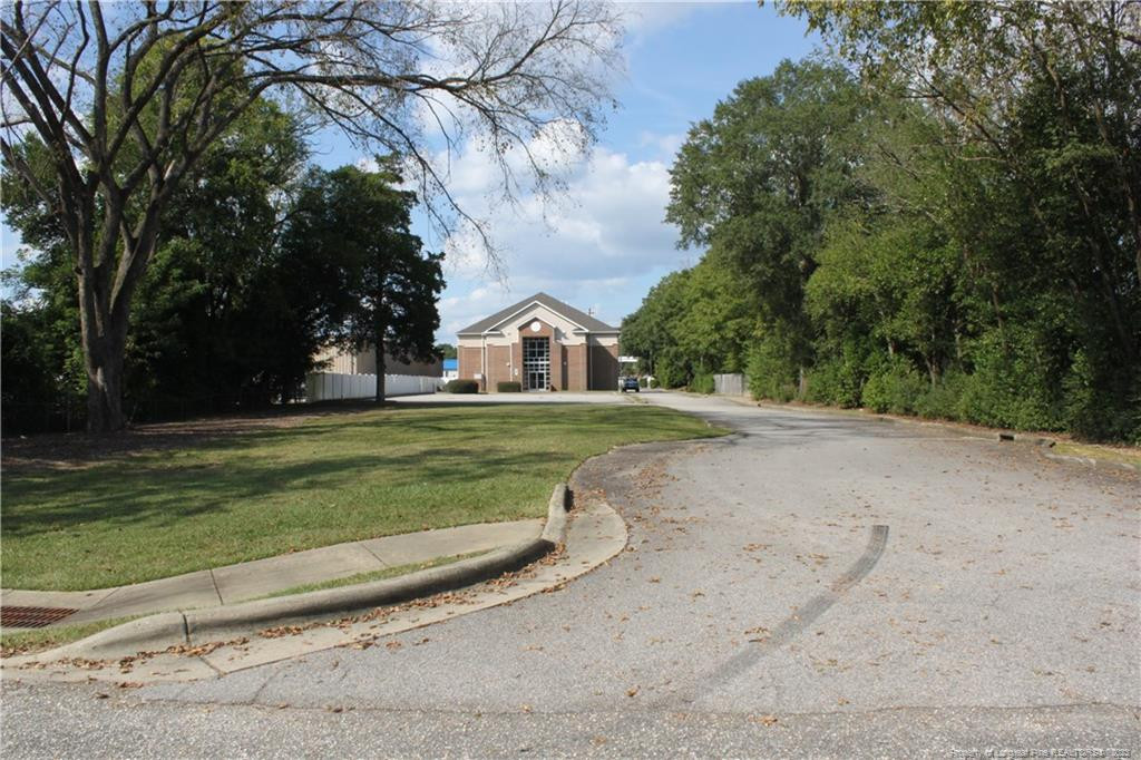 3709 Raeford Road Fayetteville, NC 28304 - Photo 41 of 44 a view of a house with a big yard