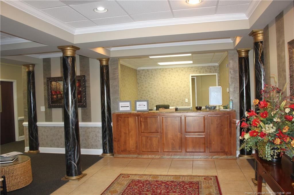 3709 Raeford Road Fayetteville, NC 28304 - Photo 6 of 44 a view of a hallway with a potted plant