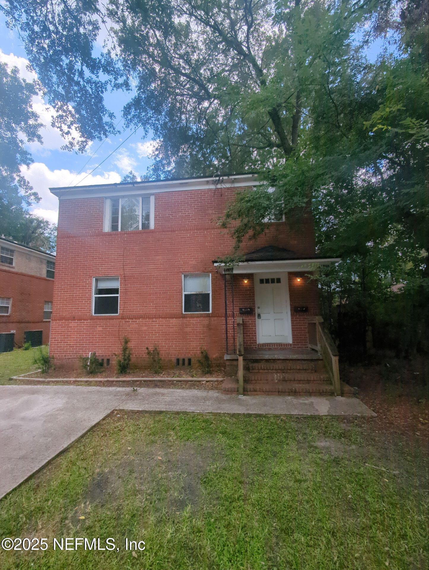 3136 Post Street Jacksonville, FL 32205 - Photo 1 of 16 front view of a house with a yard