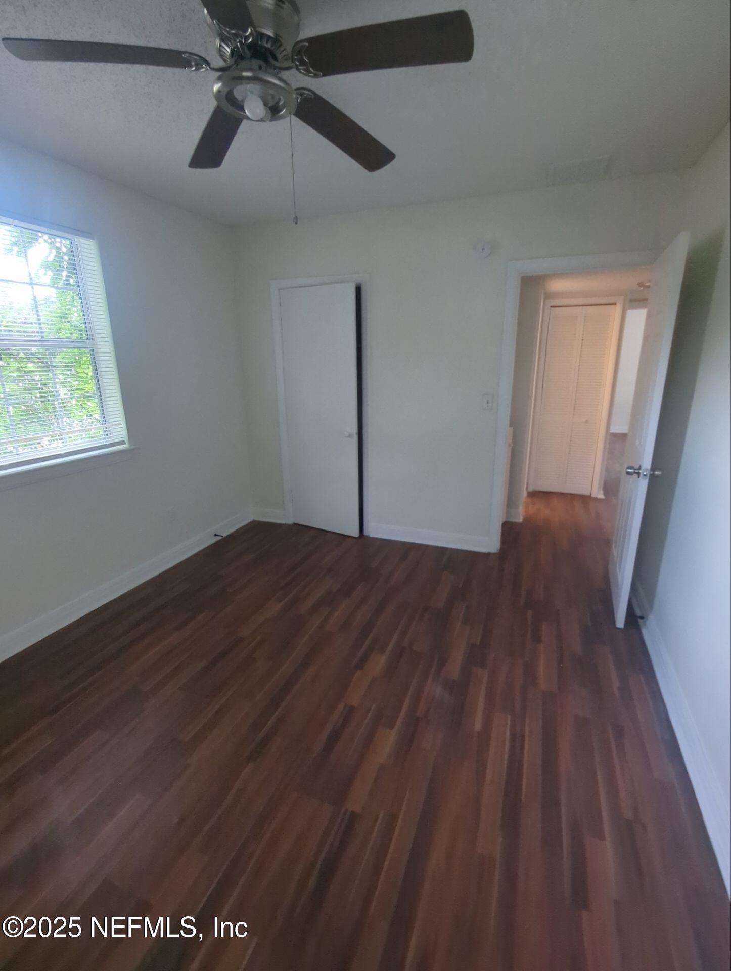 3136 Post Street Jacksonville, FL 32205 - Photo 12 of 16 a view of empty room with wooden floor and fan