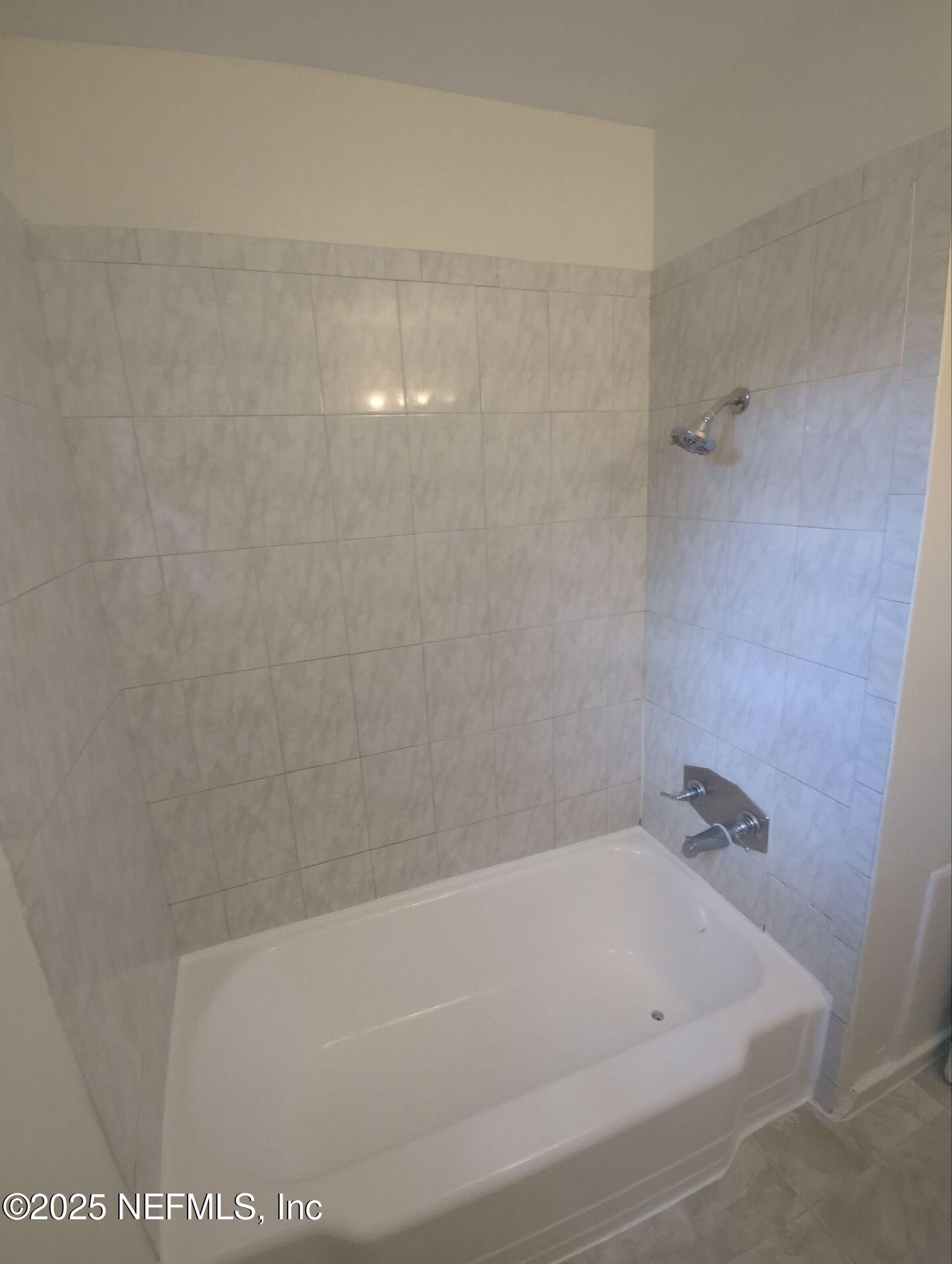 3136 Post Street Jacksonville, FL 32205 - Photo 16 of 16 a bathroom with a bathtub