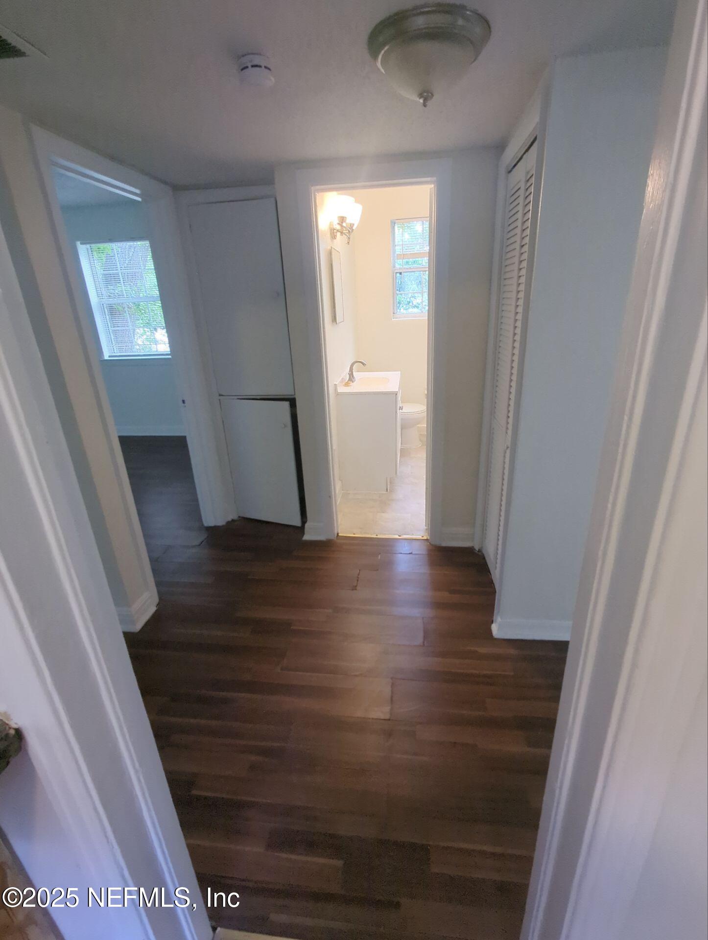 3136 Post Street Jacksonville, FL 32205 - Photo 5 of 16 a view of a hallway with wooden floor and staircase