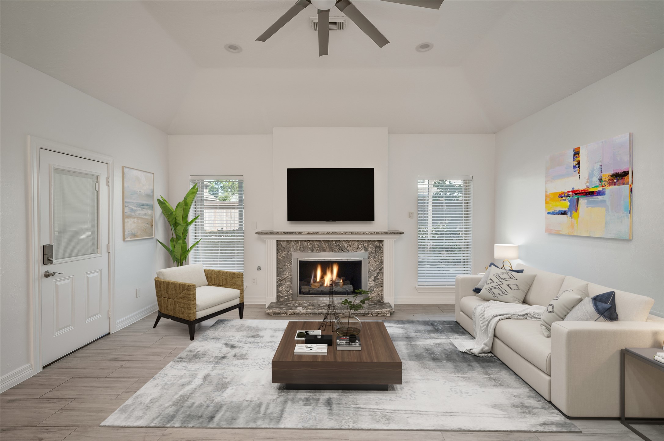 5527 Fragrant Cloud Court Houston, TX 77041 - Photo 12 of 38 a living room with furniture a fireplace and a flat screen tv