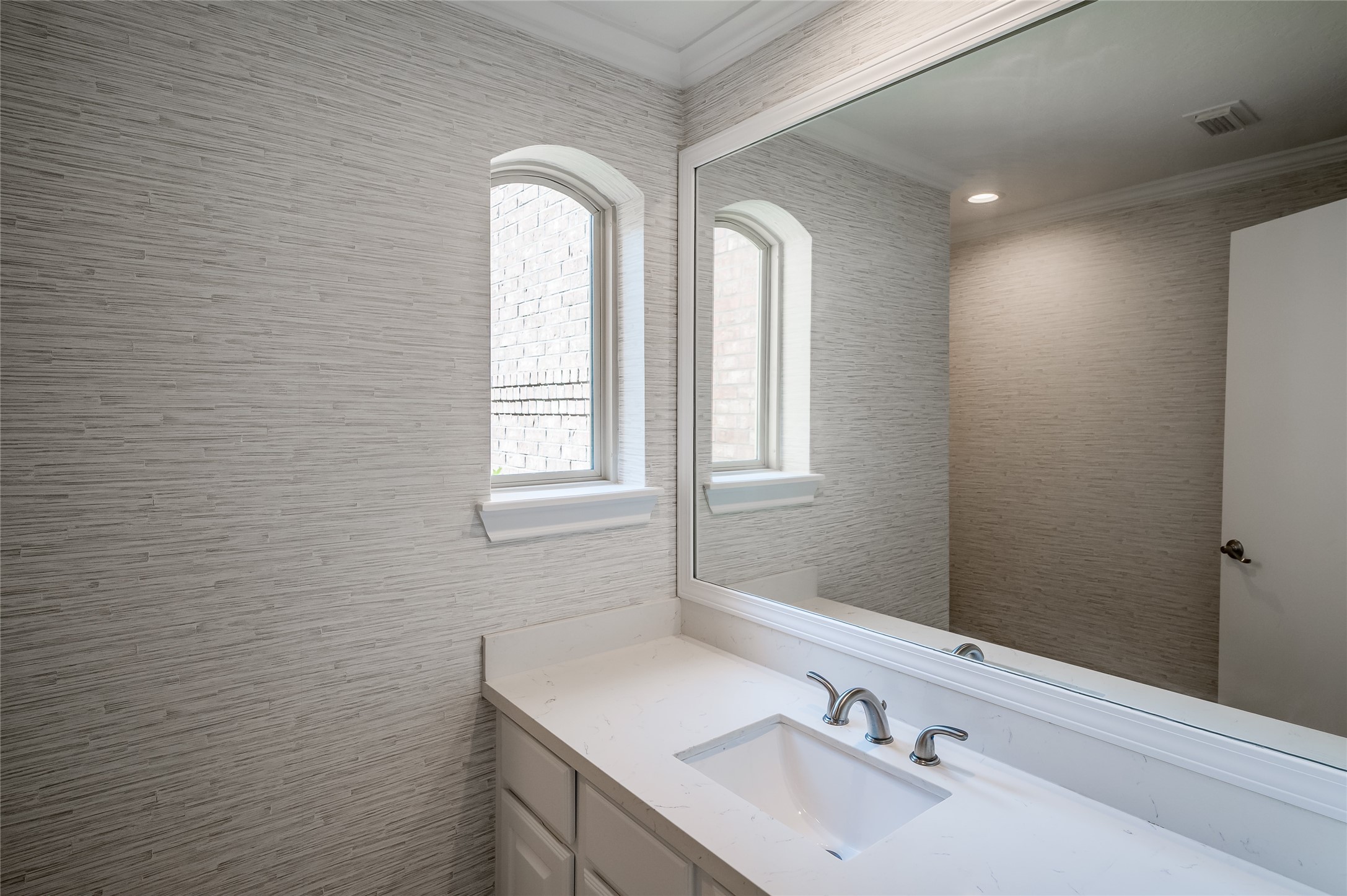 5527 Fragrant Cloud Court Houston, TX 77041 - Photo 14 of 38 a bathroom with a sink and a mirror