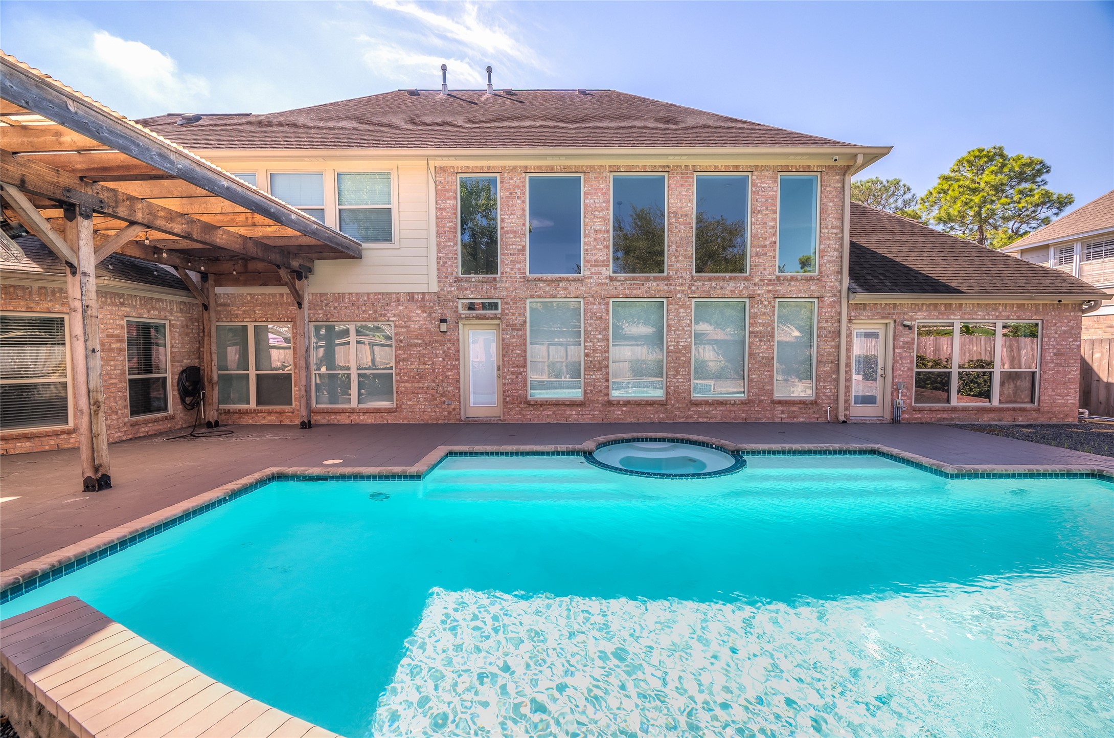 5527 Fragrant Cloud Court Houston, TX 77041 - Photo 2 of 38 a front view of a house with swimming pool and porch