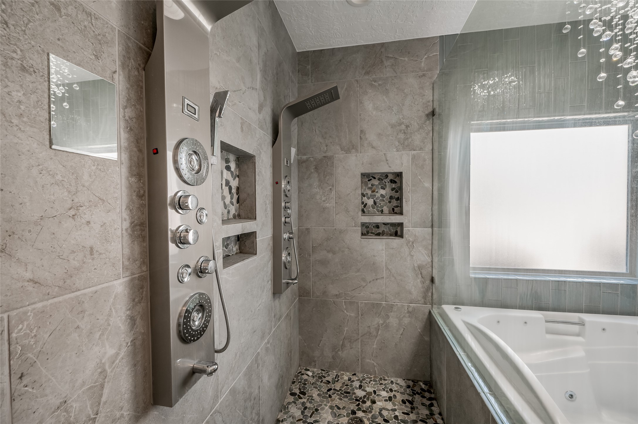 5527 Fragrant Cloud Court Houston, TX 77041 - Photo 20 of 38 a bathroom with a bathtub and shower