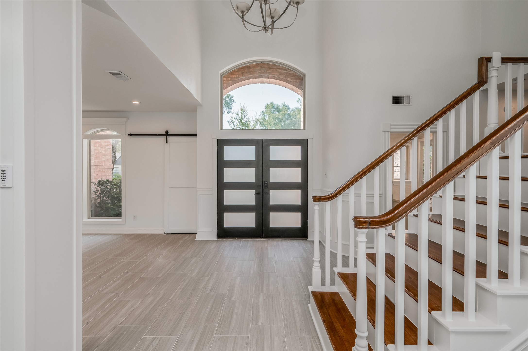 5527 Fragrant Cloud Court Houston, TX 77041 - Photo 4 of 38 a view of an entryway with wooden floor