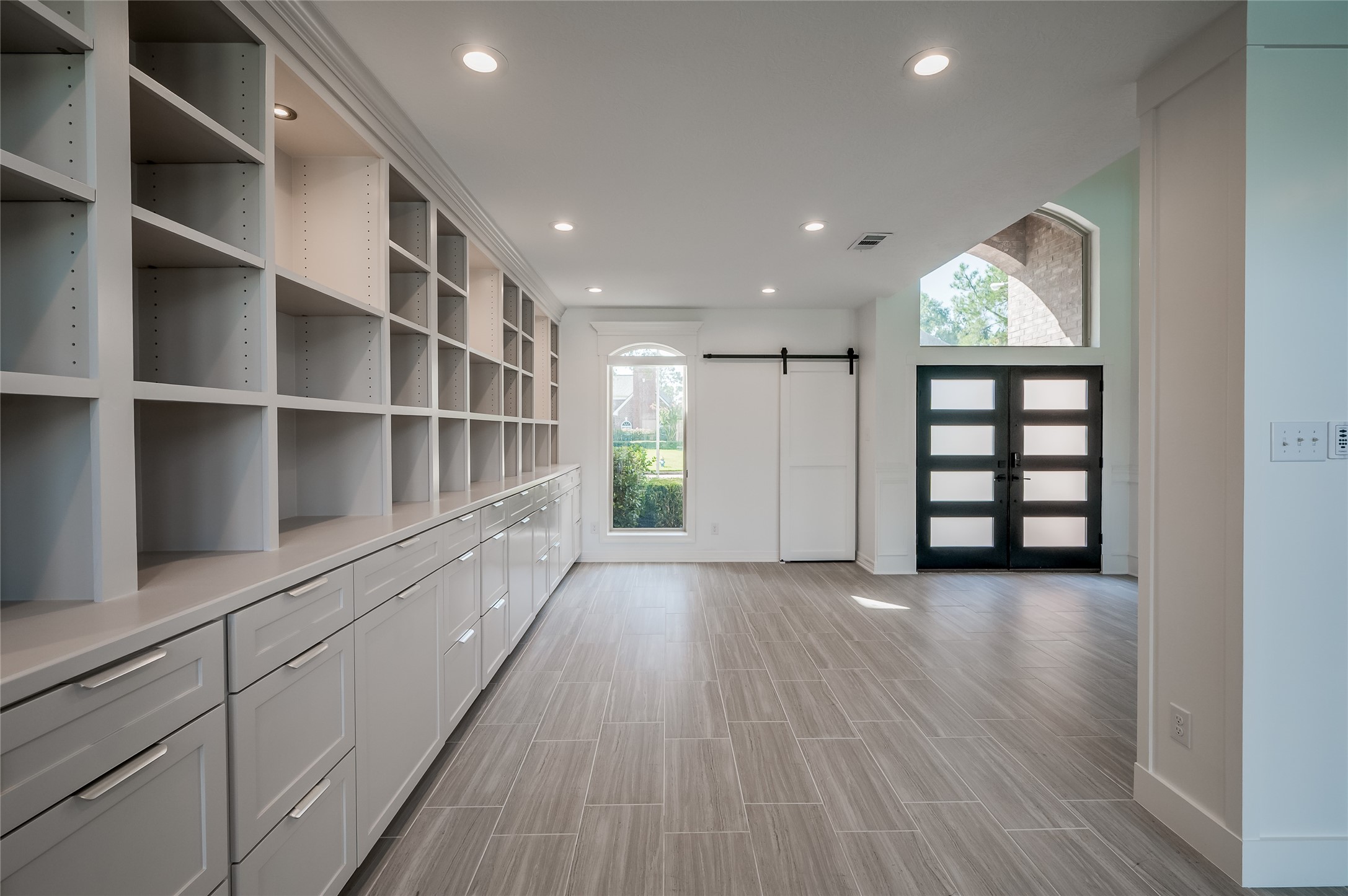 5527 Fragrant Cloud Court Houston, TX 77041 - Photo 5 of 38 a view of an empty room with a window and wooden floor