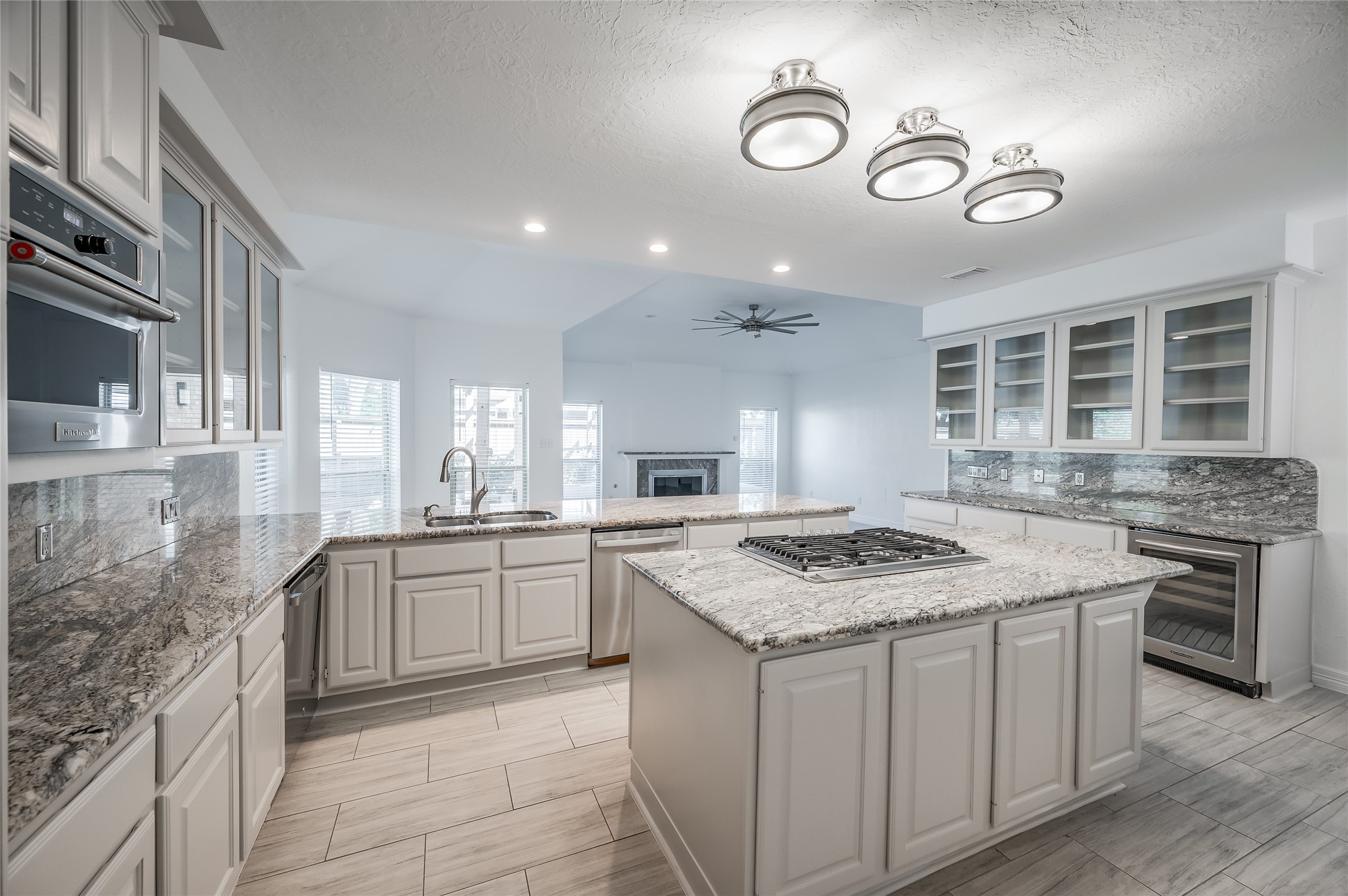 5527 Fragrant Cloud Court Houston, TX 77041 - Photo 9 of 38 a kitchen with a stove sink and cabinets