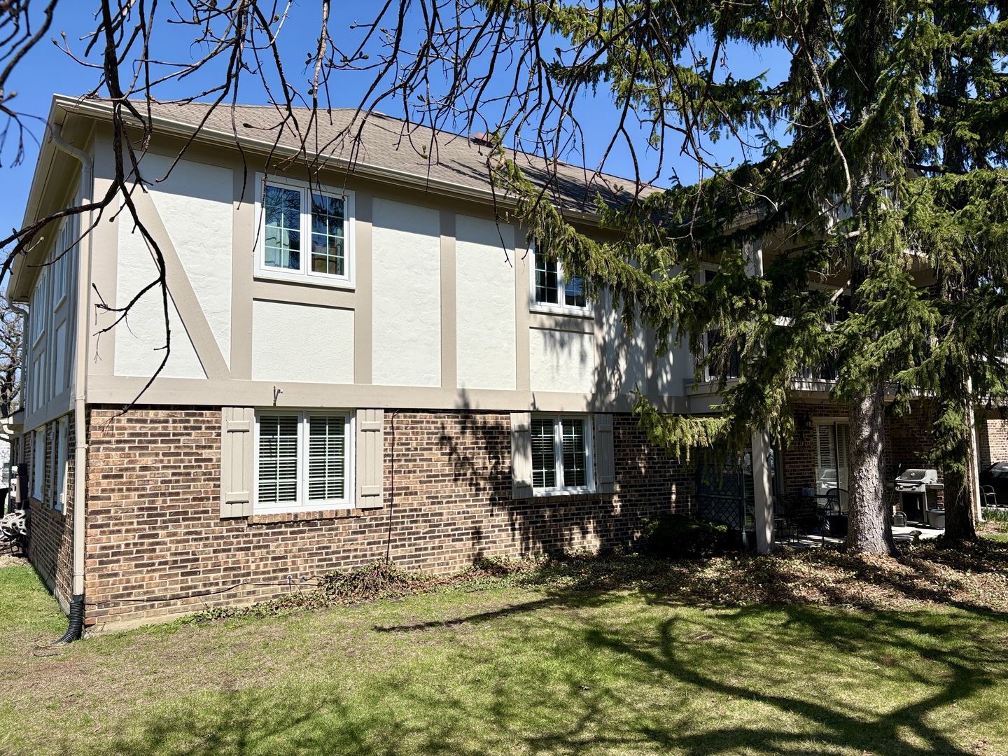 5802 Wolf Road, Unit 1 Western Springs, IL 60558 - Photo 16 of 16 a view of a house with a yard