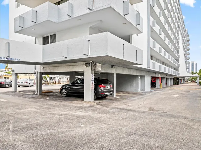 a view of a car park in front of building