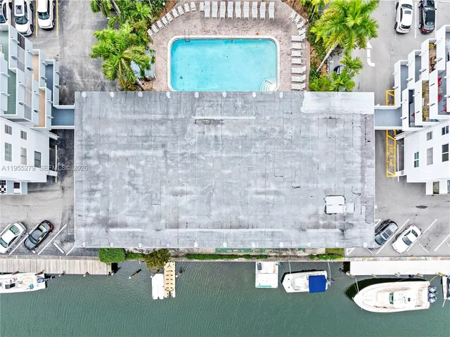 a picture of a wooden table with chairs