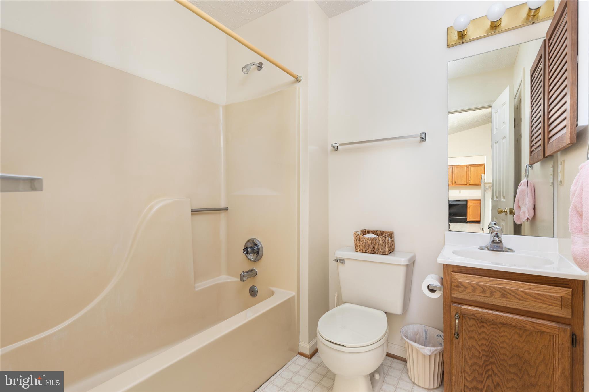 1057 Harmony Orchard Road Front Royal, VA 22630 - Photo 15 of 48 a bathroom with a granite countertop toilet a sink and a bathtub