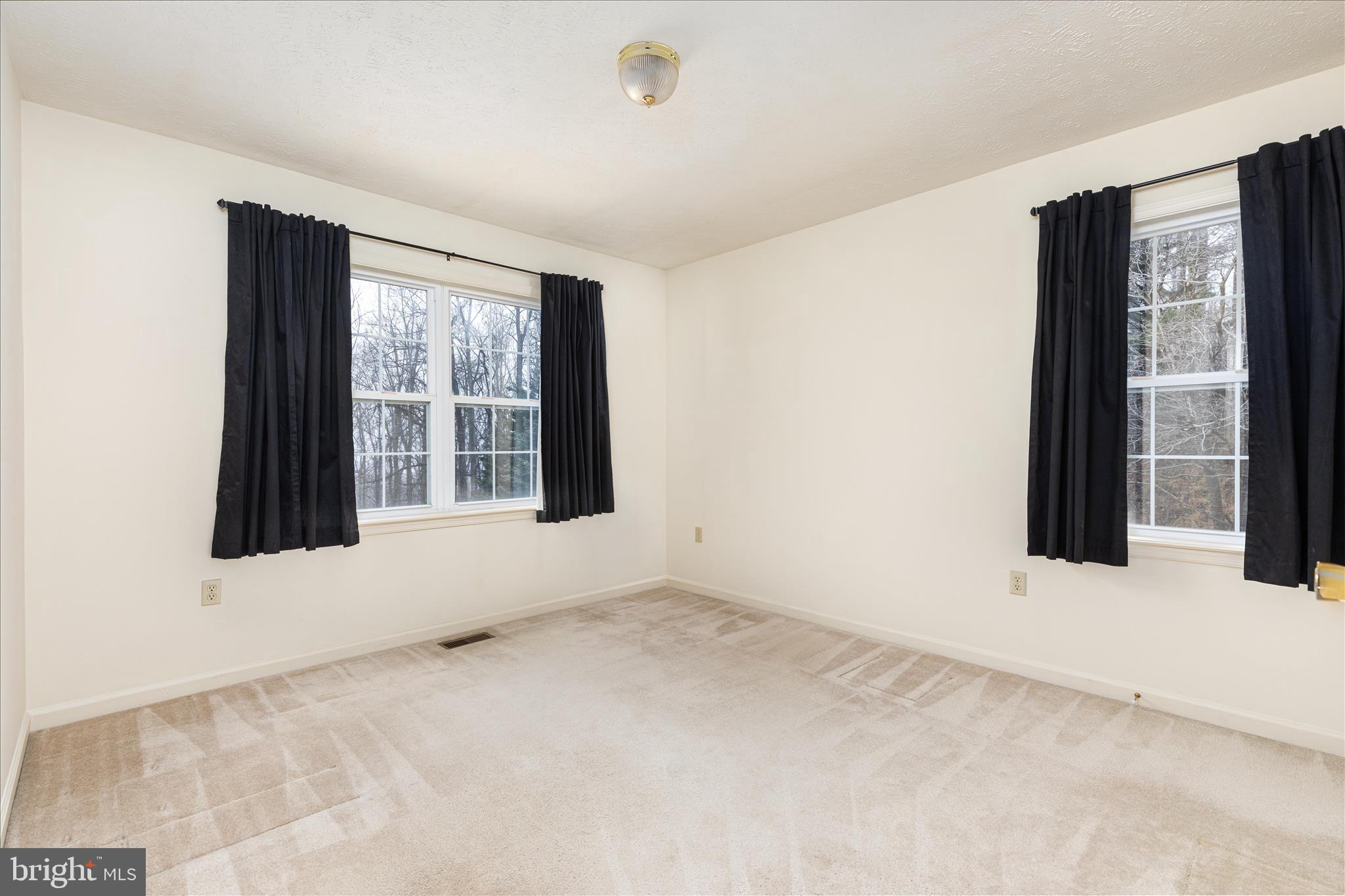 1057 Harmony Orchard Road Front Royal, VA 22630 - Photo 16 of 48 a view of an empty room with a window