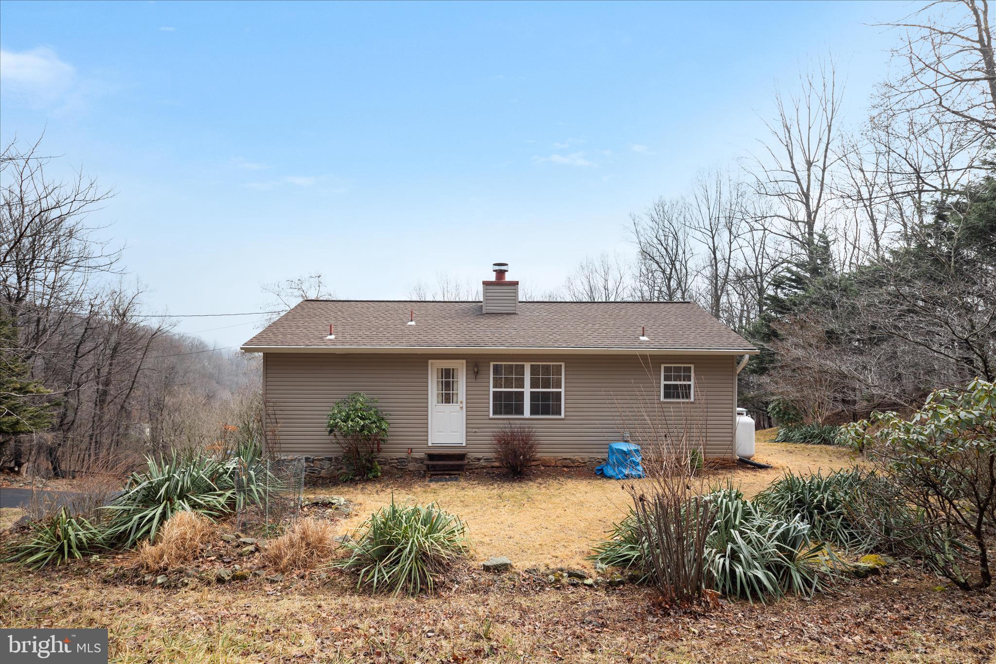 1057 Harmony Orchard Road Front Royal, VA 22630 - Photo 29 of 48 a view of a house with backyard and garden