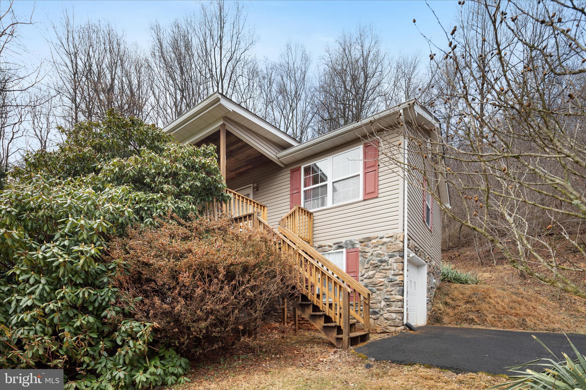 1057 Harmony Orchard Road Front Royal, VA 22630 - Photo 31 of 48 a house that has a tree in front of it