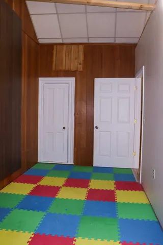 a room that has a rug and tent in it