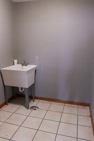 a view of a room with wooden floor and chair