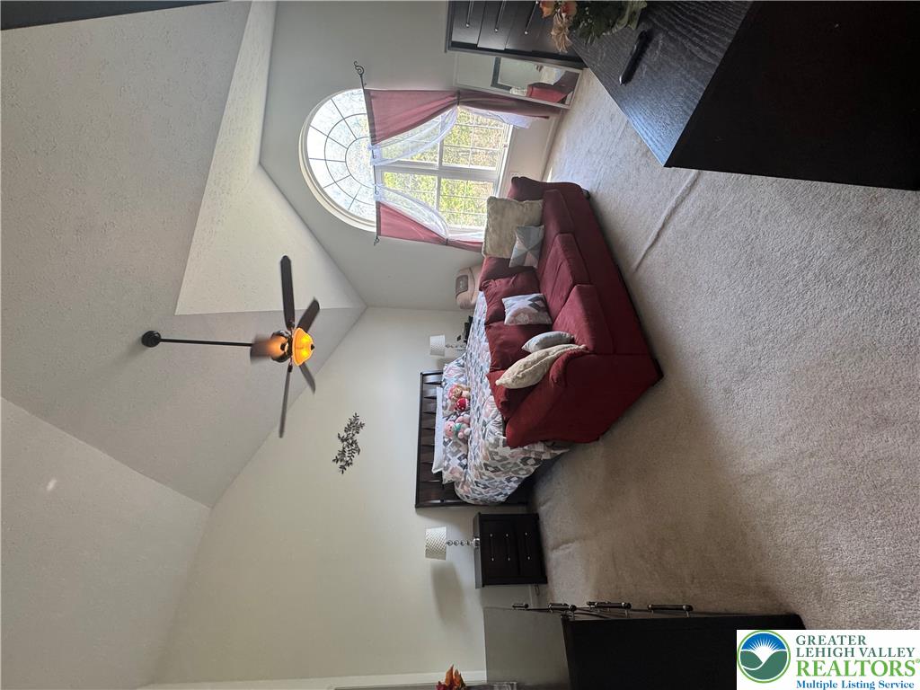 2742 Long Pond Road Long Pond, PA 18334 - Photo 37 of 57 Soaring vaulted ceilings define this sun-filled primary bedroom, offering an ideal setting for relaxation.