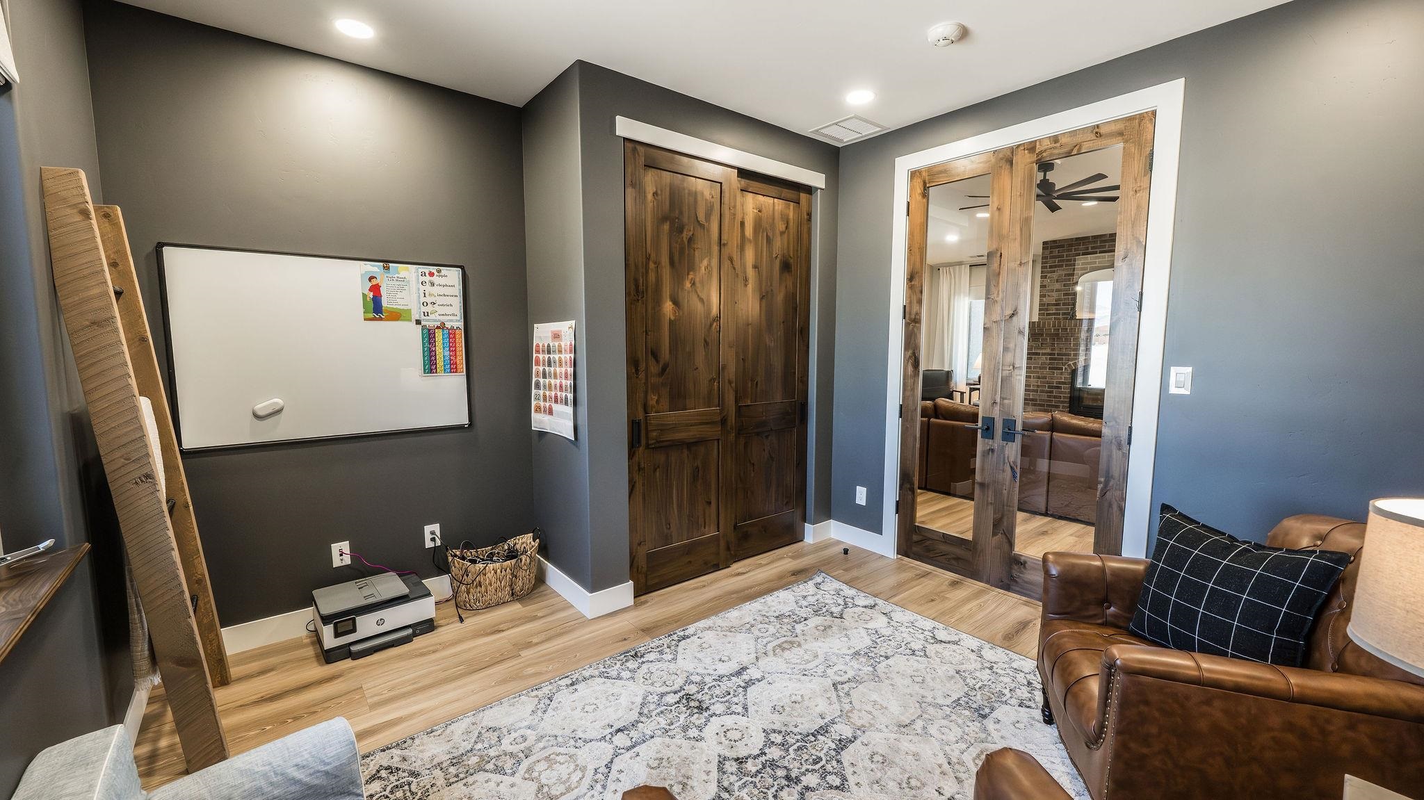 2639 Emerald Ridge Lane Grand Junction, CO 81506 - Photo 32 of 42 a bedroom with a bed and wooden floor