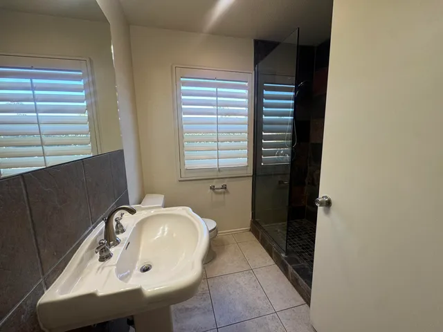 a bathroom with a sink a toilet and a tub