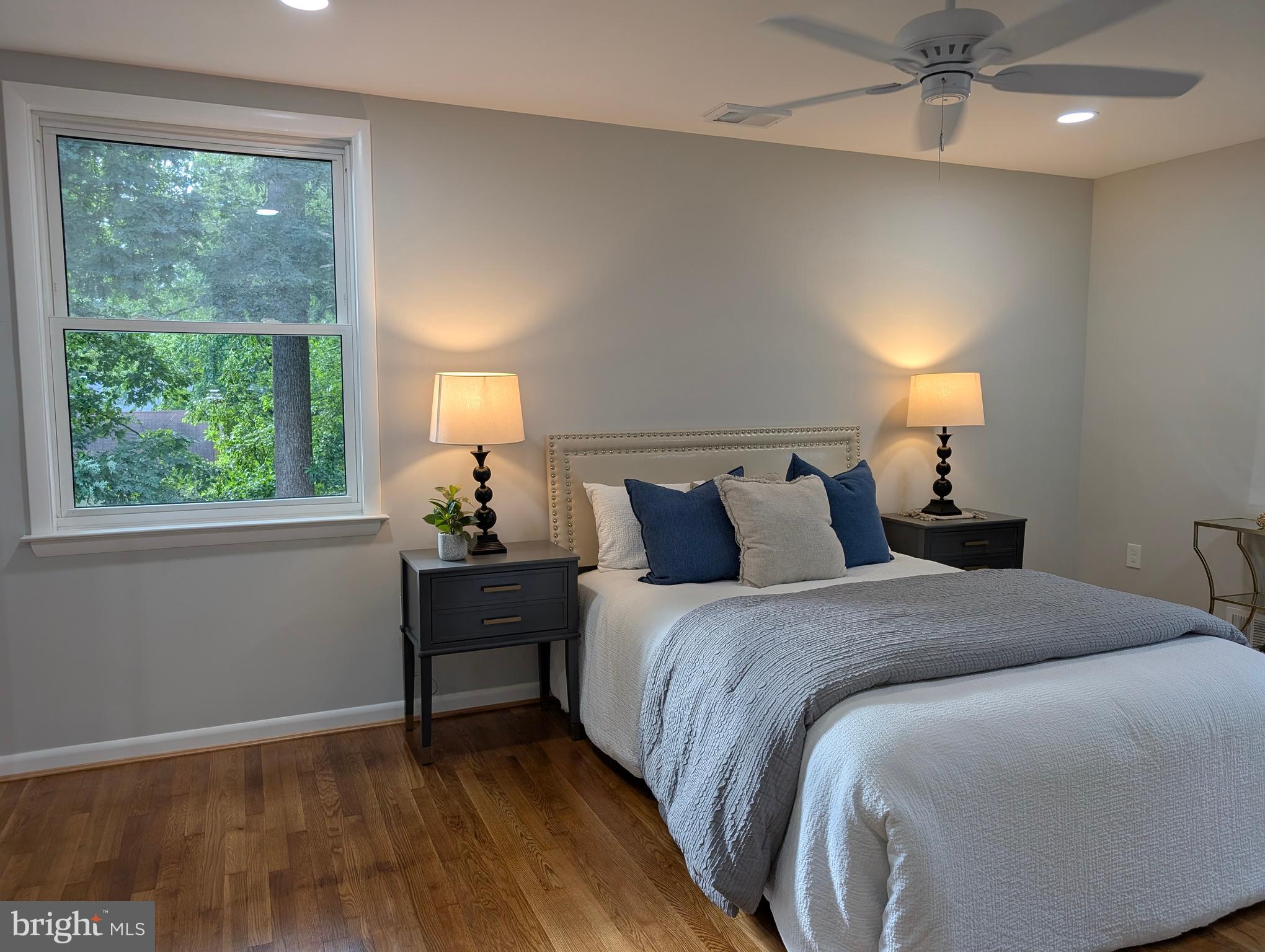 9510 Clement Road Silver Spring, MD 20910 - Photo 19 of 80 a bed room with a bed and a lamp