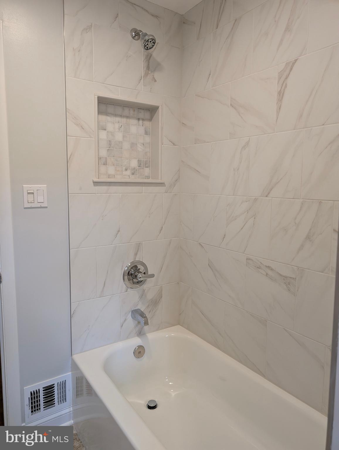 9510 Clement Road Silver Spring, MD 20910 - Photo 24 of 80 a white bath tub sitting next to a white sink and vanity