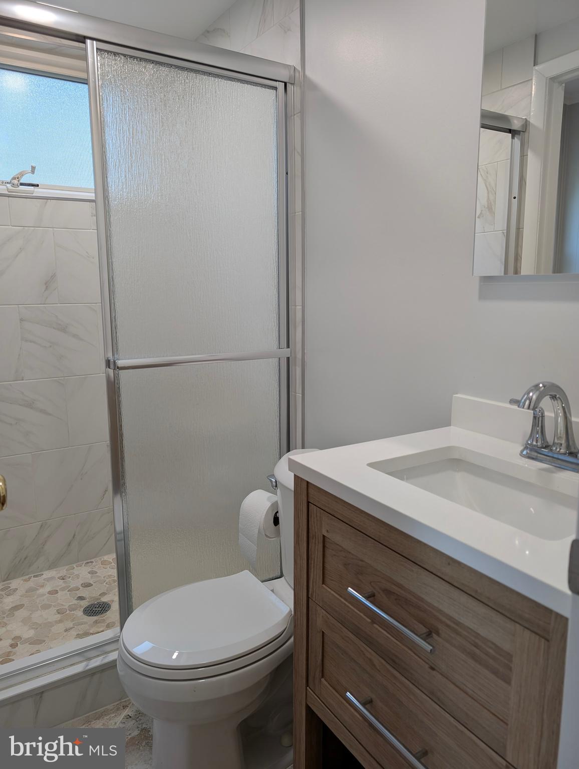 9510 Clement Road Silver Spring, MD 20910 - Photo 25 of 80 a bathroom with a granite countertop sink toilet and shower