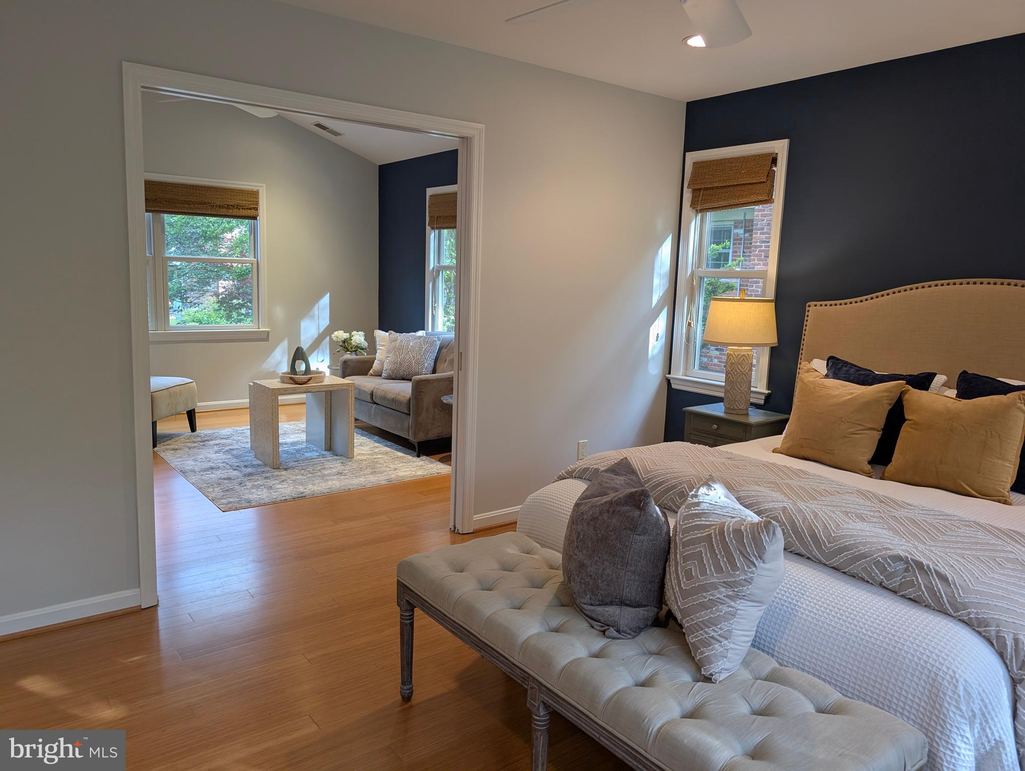 9510 Clement Road Silver Spring, MD 20910 - Photo 50 of 80 a bedroom with a bed and wooden floor